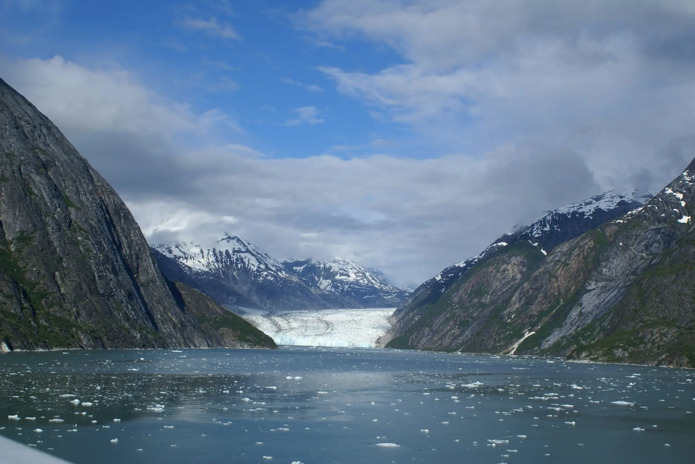 Dawes Glacier at the head of Endicott Arm, between steep mountain walls